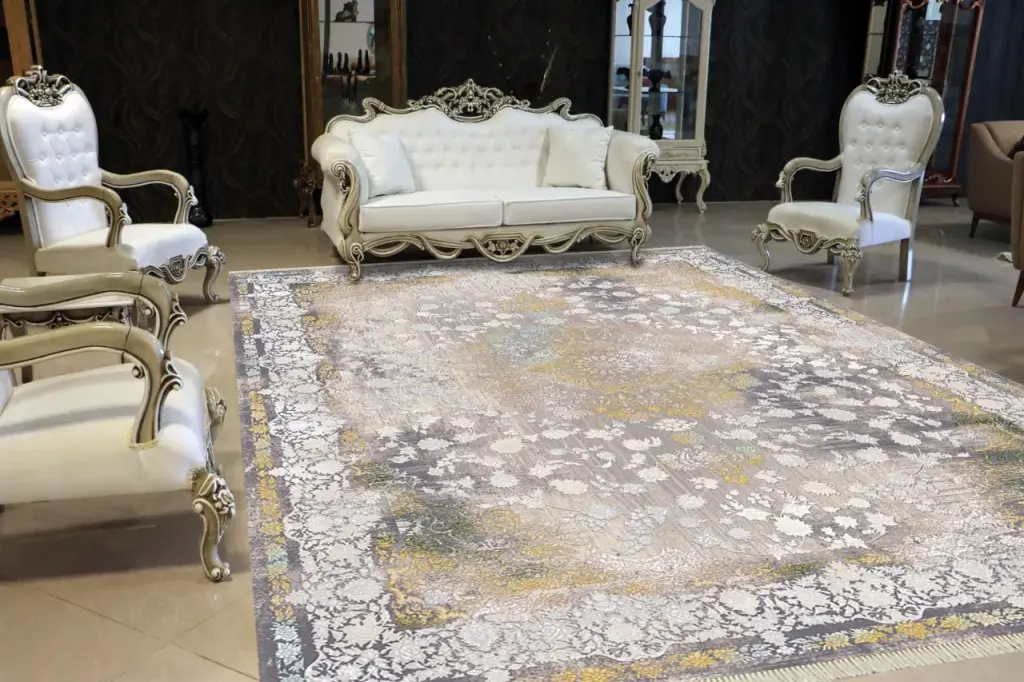 Grey and gold acrylic carpet in a classic seating area with white tufted chairs